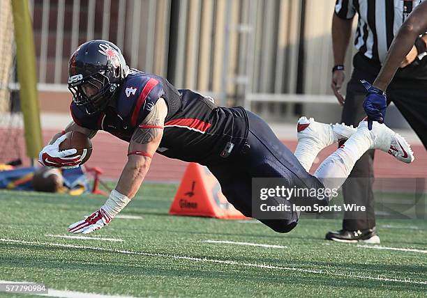 Richmond RB Seth Fisher dives for extra yards. Richmond Spiders host Morehead State Eagles at Robins Stadium on the campus of the University of...