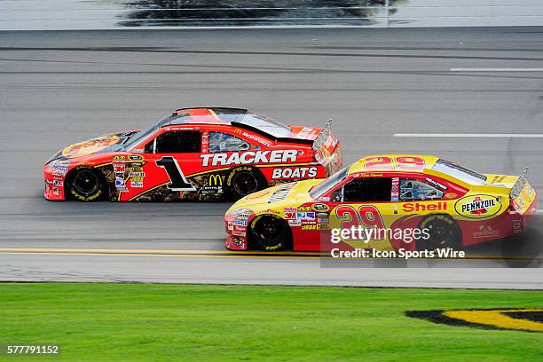 Kevin Harvick Richard Childress Racing Chevrolet Impala SS makes the final pass on Jamie McMurray Earnhardt Ganassi Racing Chevrolet Impala SS to win...