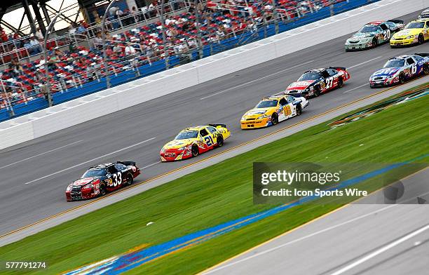 Kevin Harvick leads Clint Bowyer and Jamie McMurray during the Aaron's 312 at the Talladega Superspeedway in Talladega, AL.