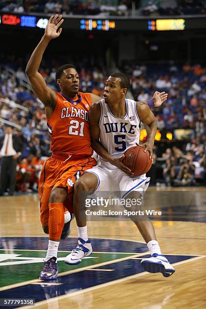 Duke Blue Devils forward Rodney Hood dribbles against Clemson Tigers guard Damarcus Harrison during the ACC Mens Basketball Tournament Championship...