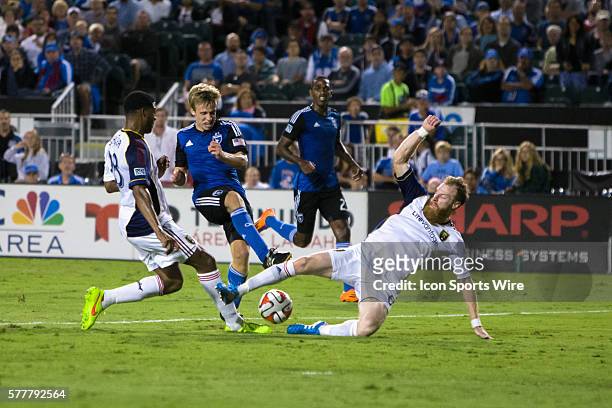 San Jose Earthquakes midfielder Tommy Thompson drives to goal as Real Salt Lake defender Nat Borchers and Real Salt Lake defender Chris Schuler...
