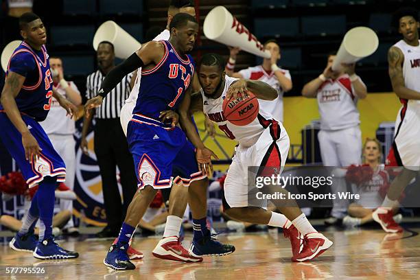 University of Louisiana Lafayette Bryant Mbamalu tries to get around Texas-Arlington Mavericks guard Reger Dowell during the ULL v UT Arlington Men's...