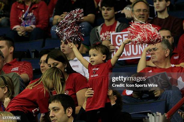 Young Ragin' Cajun cheers her team during the WKU v University of Louisiana Lafayette Men's Semifinal basketball game at UNO Lakefront Arena, New...