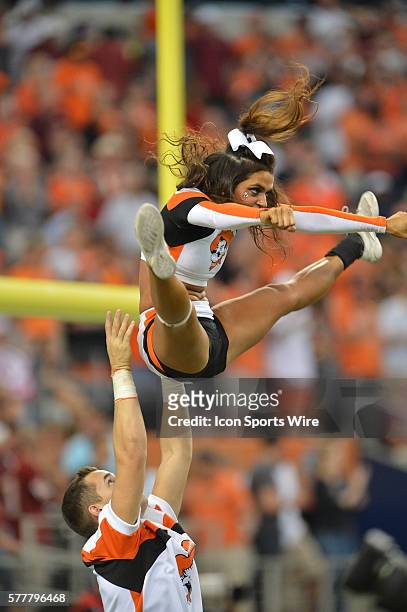 Oklahoma State Cowboys cheerleader performing on the field during the Cowboys Classic - Florida State at Oklahoma State at AT&T Stadium in Arlington,...