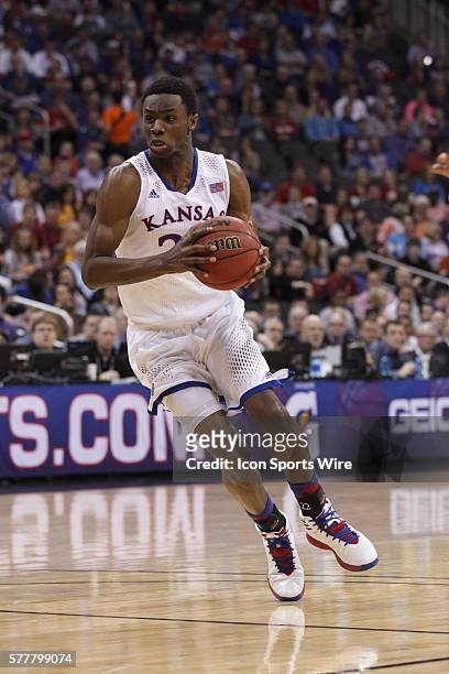 Kansas Jayhawks guard Andrew Wiggins prepares to drive with the ball during the semifinals of the Phillips 66 Big 12 Men's Basketball Championship....