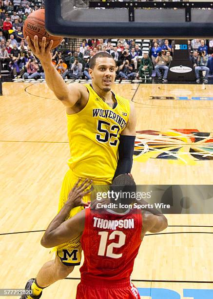 Jordan Morgan of the Michigan Wolverines going for a lay up during the game between against the Ohio State Buckeyes and Michigan Wolverines at the...