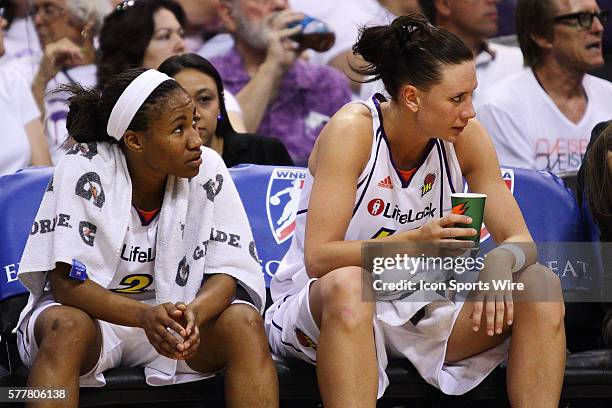 Phoenix Mercury players Temeka Johnson and Penny Taylor on the bench during a WNBA game between the Seattle Storm and the Phoenix Mercury at U.S....