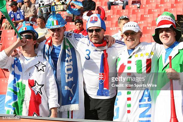 Italy fans pose with a Slovakia fan , pregame. The Slovakia National Team played the Italy National Team at Ellis Park Stadium in Johannesburg, South...