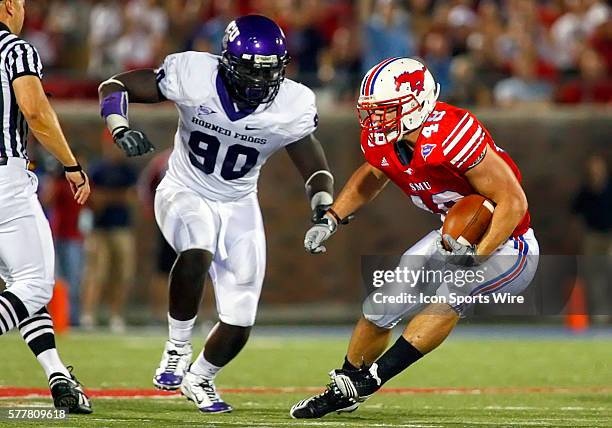 Southern Methodist running back Zach Line is pursued by TCU defensive end Stansly Maponga during the first half of TCU Horned Frogs vs. The SMU...