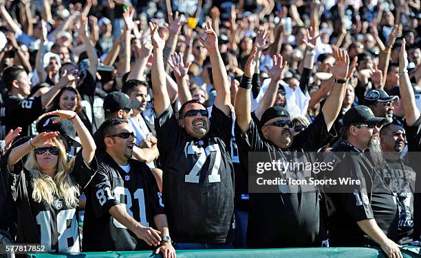 Oakland Black Hole fans celebrate fourth quarter touchdown by the Raiders as the Oakland Raiders defeated the San Diego Chargers by a score of 35-27...