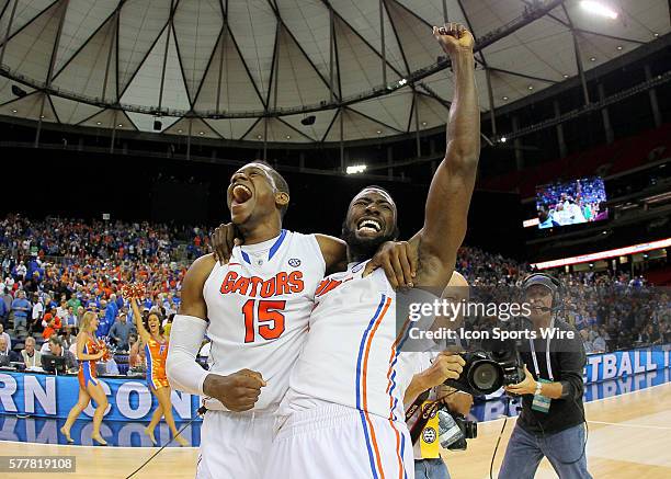 Florida Gators forward Will Yeguete celebrates with center Patric Young in the Florida Gators 61-60 victory over the Kentucky Wildcats in the SEC...