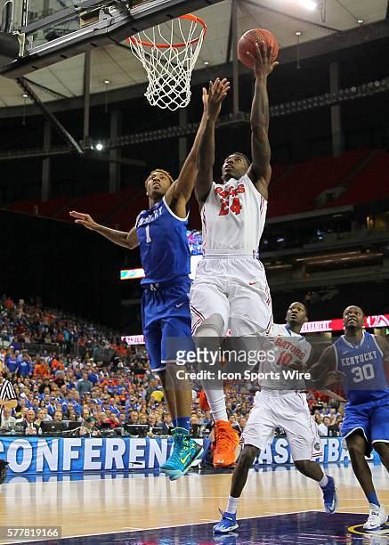 Florida Gators forward Casey Prather goes up for the shot over Kentucky Wildcats guard/forward James Young in the Florida Gators 61-60 victory over...
