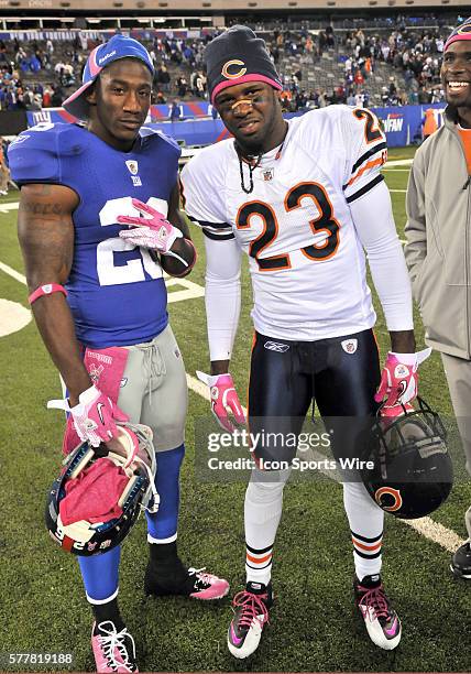 New York Giants Antrel Rolle Safety poses for a picture with Bears Devin Hester Wide Receiver after the game during the Chicago Bears vs New York...