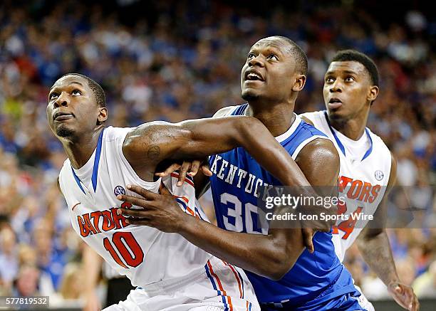 All Tournament team player Julius Randle of North Carolina, Dorian Finney-Smith and Casey Prather of Florida look for the rebound from the free throw...