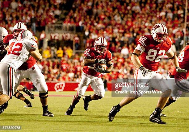 Wisconsin Badgers running back James White brings the ball upfield for a Badgers touchdown. The Wisconsin Badgers won over the Ohio State Buckeyes...