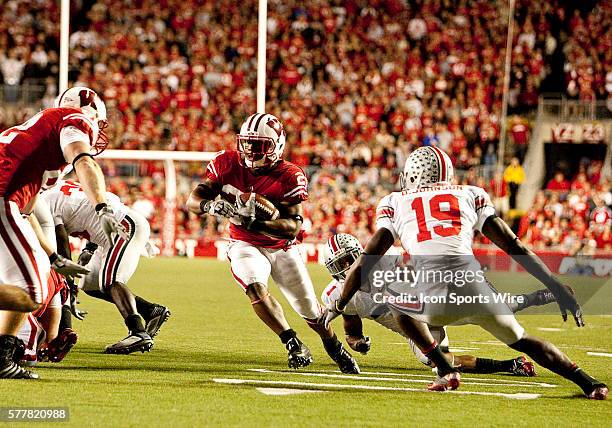 Wisconsin Badgers running back James White brings the ball upfield for a Badgers touchdown. The Wisconsin Badgers won over the Ohio State Buckeyes...