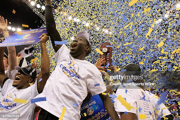 Players celebrate after defeating the Georgia State Panthers for the Sunbelt Conference men's basketball championship game at UNO Lakefront Arena,...