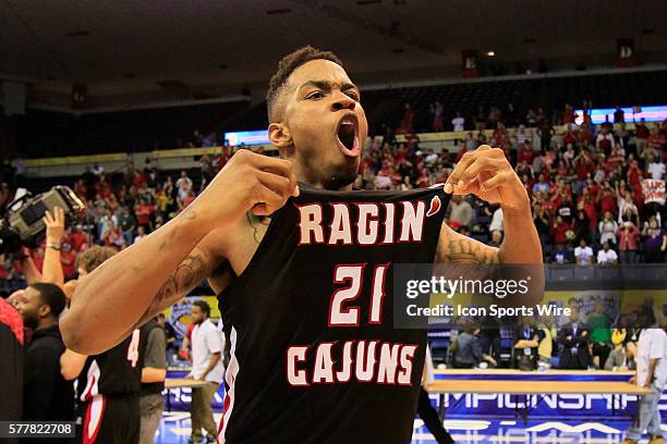 Louisiana Lafayette Ragin Cajuns forward Shawn Long celebrates after his team's victory in the Georgia State v University of Louisiana Lafayette...