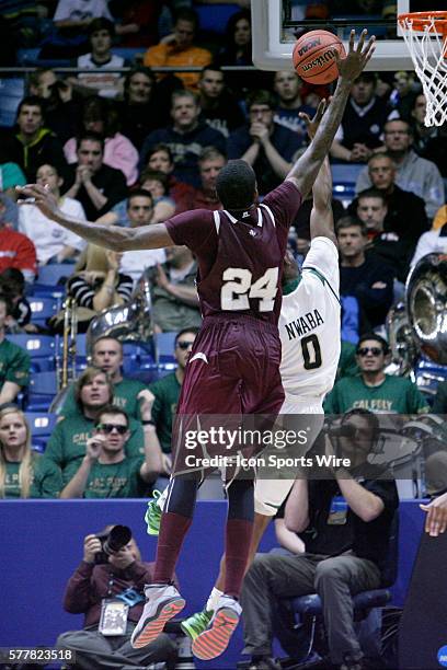 Aaric Murray of the Texas Southern Tigers reaches over W David Nwaba of the Cal Poly Mustangs to block his shot during the second half of the Cal...