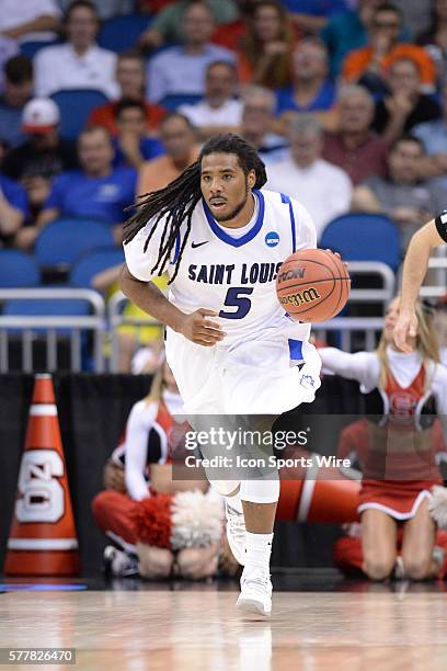 Jordair Jett of the Saint Louis Billikens races up court during the NC State Wolfpack game versus the Saint Louis Billikens in the Second Round of...