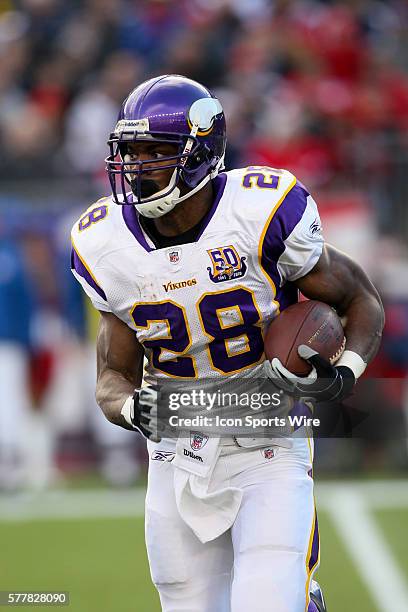 Minnesota Vikings running back Adrian Peterson runs with the ball. The New England Patriots defeated the Minnesota Vikings by a score of 28 to 18 at...