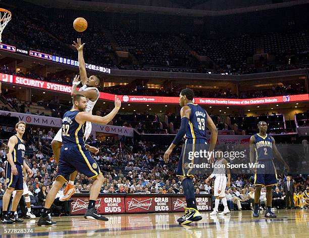 Charlotte Bobcats power forward Boris Diaw shoots over Indiana Pacers power forward Josh McRoberts during an NBA basketball game at Time Warner Cable...