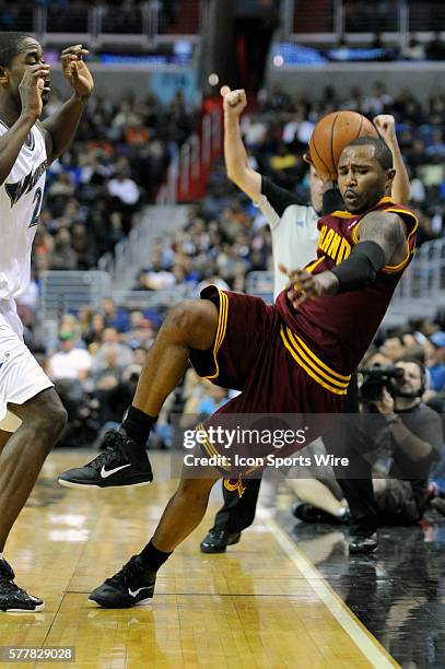 Cleveland Cavaliers point guard Mo Williams is fouled out of bounds by Washington Wizards center Hilton Armstrong at the Verizon Center in...