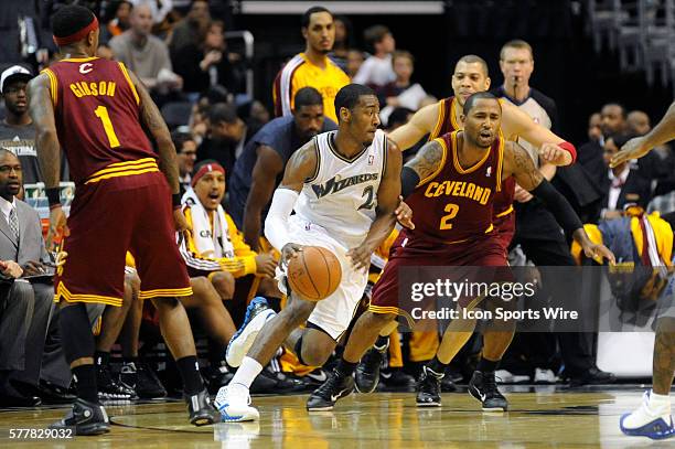 Washington Wizards point guard John Wall in action against Cleveland Cavaliers point guard Mo Williams at the Verizon Center in Washington, D.C....