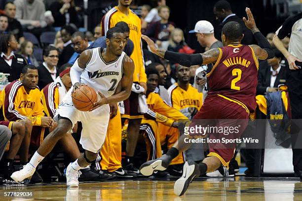 Washington Wizards point guard John Wall in action against Cleveland Cavaliers point guard Mo Williams at the Verizon Center in Washington, D.C....