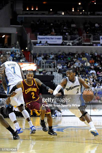 Washington Wizards point guard John Wall in action against Cleveland Cavaliers point guard Mo Williams at the Verizon Center in Washington, D.C....