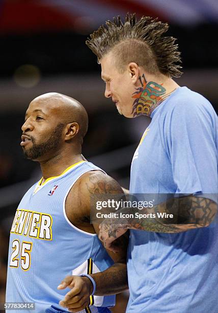 Los Angeles, CA Denver Nuggets point guard Anthony Carter and Denver Nuggets center Chris Andersen talk on the sideline as the Los Angeles Clippers...