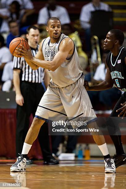 Julian Vaughn looks to pas the ball during the Coastal Carolina vs Georgetown game at the Carolina First Arena in Charleston, SC. Georgetown defeated...