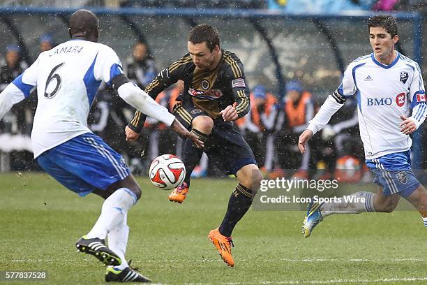 Philadelphia Union forward Jack McInerney controls a high ball in front of Montreal Impact forward Marco Di Vaio during an MLS game at PPL Park in...