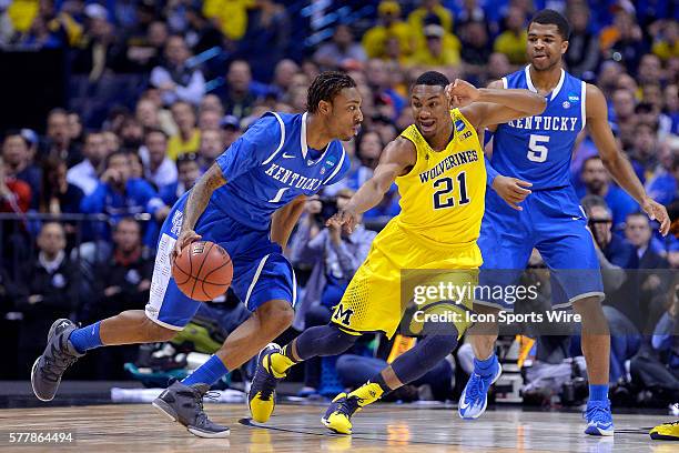 Kentucky Wildcats guard/forward James Young battles with Michigan Wolverines guard Zak Irvin in action during the Div I Men's Championship - Elite...