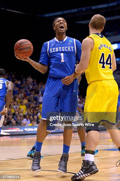 Kentucky Wildcats guard/forward James Young celebrates in action during the Div I Men's Championship - Elite Eight game between the Kentucky Wildcats...