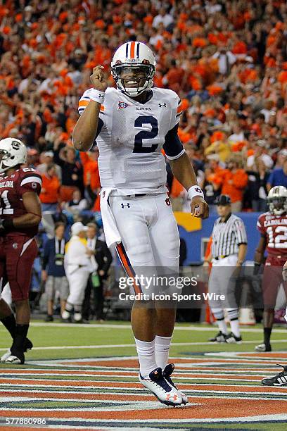 Auburn Tigers quarterback Cameron Newton celebrates in the Auburn Tigers 56-17 victory over the South Carolina Gamecocks in the SEC Championship at...