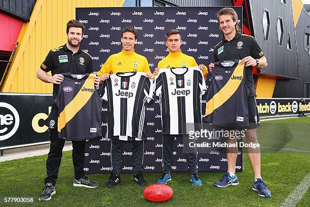 Trent Cotchin and Ivan Maric of the Tigers pose with Hernanes and Paulo Dybala of Juventus during a Richmond Tigers AFL and Juventus FC media...