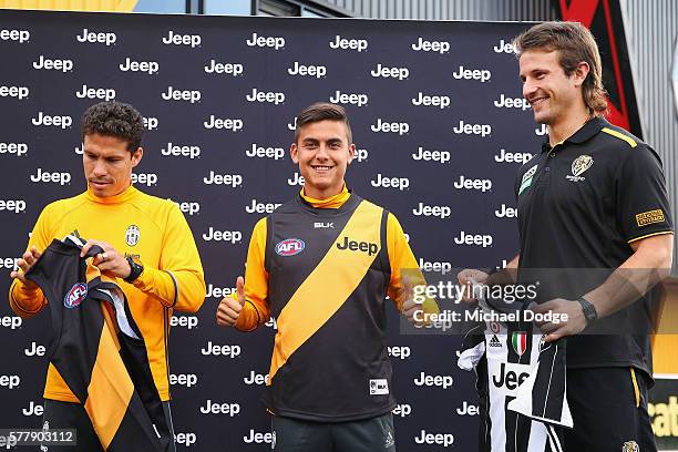 Hernanes and Paulo Dybala of Juventus exchange guernseys with Ivan Maric of the Tigers during a Richmond Tigers AFL and Juventus FC media opportunity...