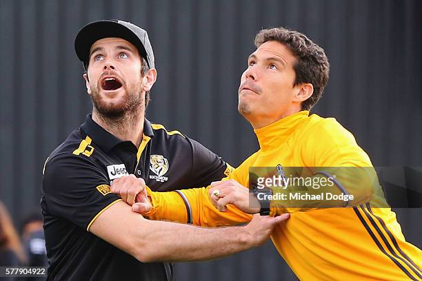 Trent Cotchin of the Tigers competes for an AFL football against Hernanes of Juventus during a Richmond Tigers AFL and Juventus FC media opportunity...