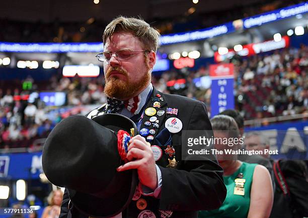 Nathan Dahlin, alternate delegate from Oregon, prays during the invocation on the second day of the Republican National Convention on Tuesday, July...
