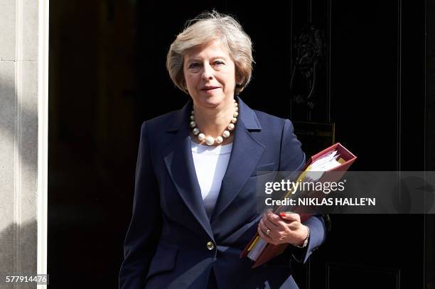 British Prime Minister Theresa May leaves 10 Downing street in London on July 20, 2016 on her way to the House of Commons to face her first session...