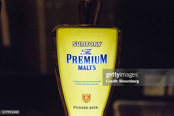 Tap of Suntory Holdings Ltd.'s The Premium Malt's Pilsner beer stands at the bar at the company's Master House bar in Hong Kong, China, on Wednesday,...