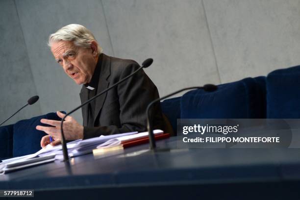 Vatican's Director of the Holy See press office, Father Federico Lombardi, gestures as he speaks during a press conference regarding Pope Francis'...