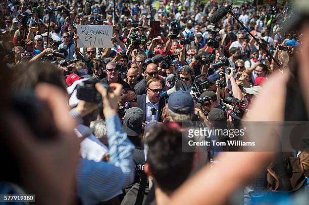 Radio host Alex Jones attends a rally before being escorted out, in the Public Square near the Republican National Convention at the Quicken Loans...