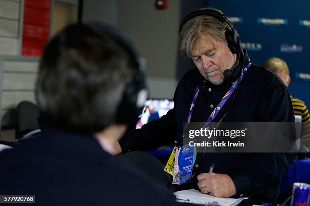 Stephen K. Bannon takes notes while listing to a caller while hosting Brietbart News Daily on SiriusXM Patriot at Quicken Loans Arena on July 20,...
