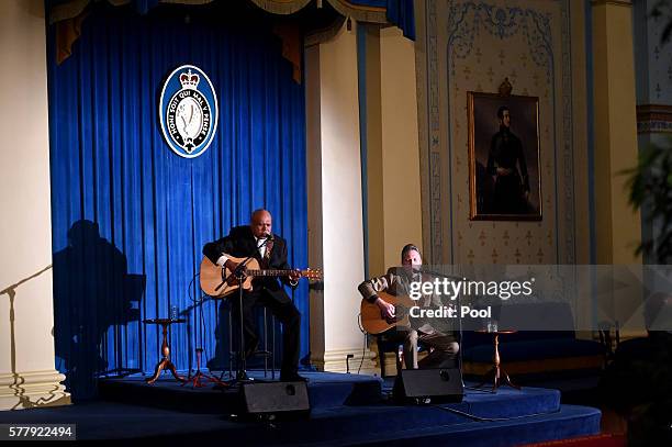 Australian aboriginal musician Archie Roach performs for the US Vice President Joe Biden during a dinner held by the Governor of Victoria Linda...