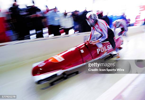 Dawid Kupczyk pushes his 2-man bobsled for Poland, finishing in 14th place at the Viessmann FIBT World Cup Bobsled Championships on Mount Van...