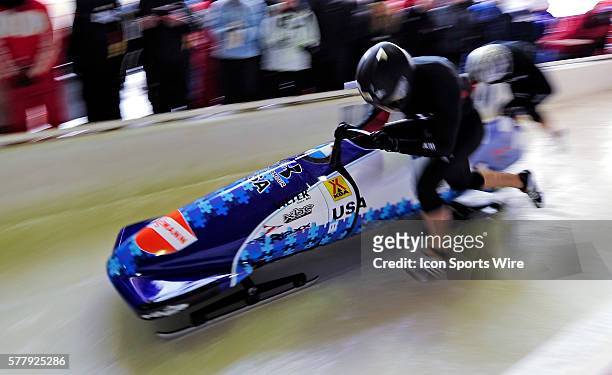 Ethan Albrecht-Carrie pushes his 2-man bobsled for the USA, finishing in 13th place at the Viessmann FIBT World Cup Bobsled Championships on Mount...