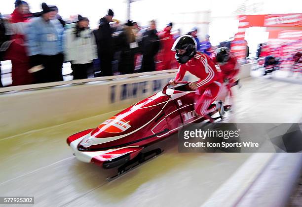 Patrice Servelle pushes his 2-man bobsled for Monaco, finishing in 9th place at the Viessmann FIBT World Cup Bobsled Championships on Mount Van...