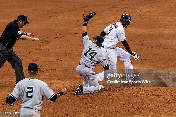 Umpire Brian Gorman with the safe call on Houston Astros right fielder L.J. Hoes sliding in front of New York Yankees second baseman Brian Roberts on...